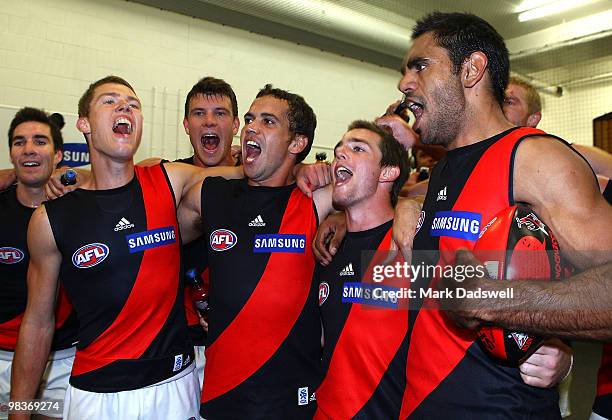 Jake Melksham; Mark Williams, Travis Colyer and Nathan Lovett-Murray of the Bombers sing the team song after winning the round three AFL match...