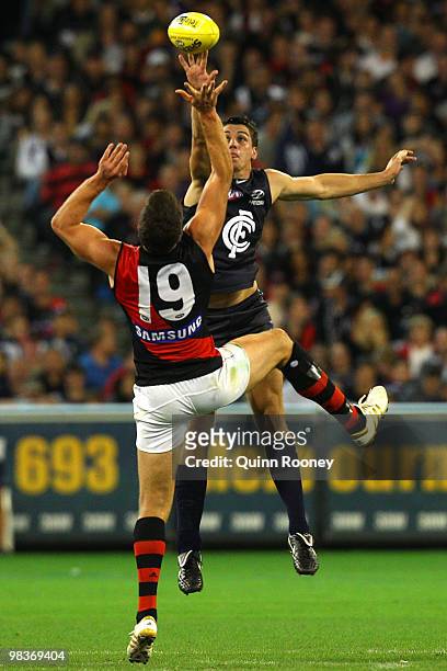 David Hille of the Bombers and Matthew Kreuzer of the Blues compete in the ruck during the round three AFL match between the Carlton Blues and the...
