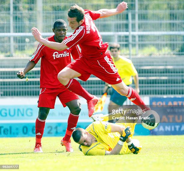 Thorsten Kirschbaum from Sandhausen battles for the ball with Marc Heider from Kiel during the Third Liga match between SV Sandhausen and Holstein...