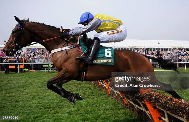 Peddlers Cross and Jason Maguire win The John Smith's Novices' Hurdle race at Aintree racecourse on April 10, 2010 in Liverpool, England.