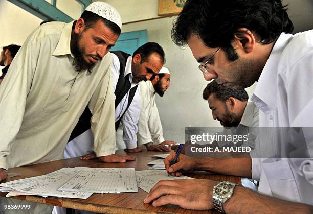 Pakistani Orakzai tribesmen Internally Displaced People who fled their homes after a military operation against militants,register with officials...