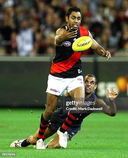 Nathan Lovett-Murray of the Bombers is tackled by Chris Yarran of the Blues during the round three AFL match between the Carlton Blues and the...