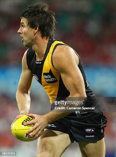 Chris Newman of the Tigers runs the ball during the round three AFL match between the Sydney Swans and the Richmond Tigers at Sydney Cricket Ground...