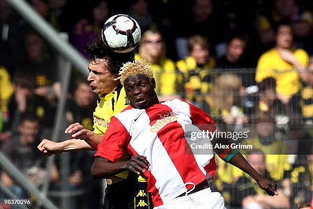 Aristide Bance of Mainz jumps for a header with Neven Subotic of Dortmund during the Bundesliga match between FSV Mainz 05 and Borussia Dortmund at...