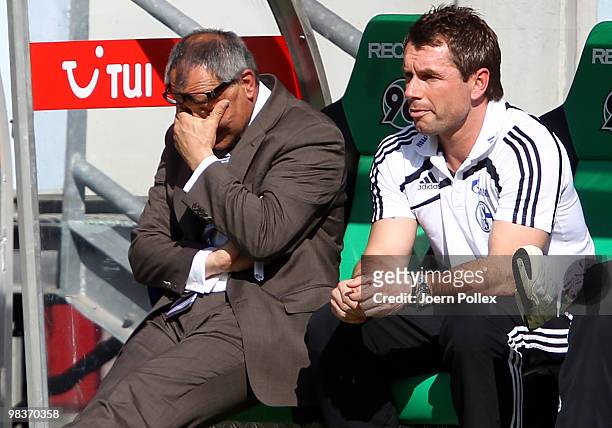 Head coach Felix Magath of Schalke and coach Bernd Hollerbach look on during the Bundesliga match between Hannover 96 and FC Schalke 04 at AWD Arena...