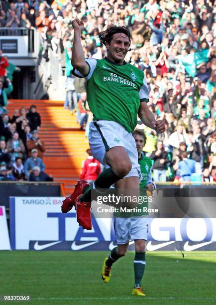 Claudio Pizarro of Bremen celebrates after he scores his team's opening goal during the Bundesliga match between Werder Bremen and SC Freiburg at the...