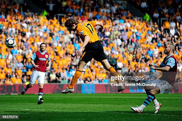 Kevin Kilbane of Hull Ciy scores the opening goal during the Barclays Premier League match between Hull City and Burnley at the KC Stadium on April...