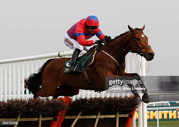 Khyber Kim ridden by Paddy Brennan clears the last fence on their way to victory in The John Smith's Dick Francis Aintree Hurdle at Aintree...