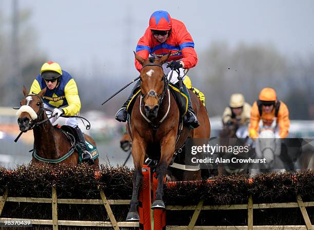 Khyber kim and Paddy Brennan jump the last to win The John Smith's Dick Francis Aintree Hurdle at Aintree racecourse on April 10, 2010 in Liverpool,...