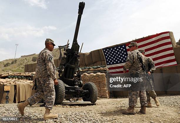 Army soldiers walk in US military Camp Wilderness in Khost province on April 10, 2010. The United States and NATO have deployed some 113,000 troops...