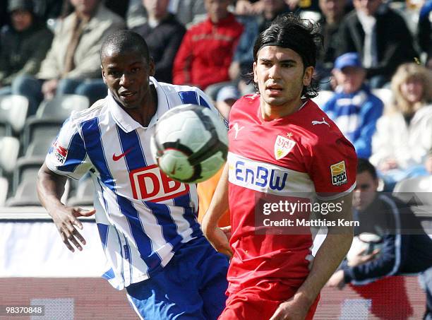 Adrian Ramos of Berlin battles for the ball with Serdar Tasci of Stuttgart during the Bundesliga match between Hertha BSC Berlin and VFB Stuttgart at...