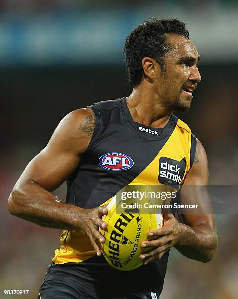 Richard Tambling of the Tigers runs the ball during the round three AFL match between the Sydney Swans and the Richmond Tigers at Sydney Cricket...