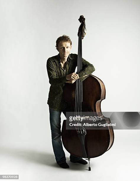 man rests on his cello.  - alberto guglielmi stock pictures, royalty-free photos & images