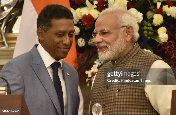 Prime Minister Narendra Modi with Seychelles President Danny Antoine Rollen Faure after handing over the replica of Dornier Aircraft, during a...