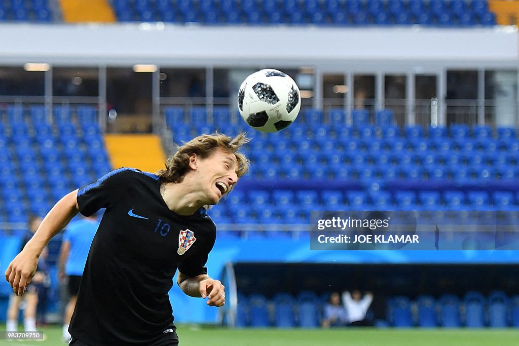 Modric Exercise Croatia's midfielder Luka Modric controls the ball as he takes part ...