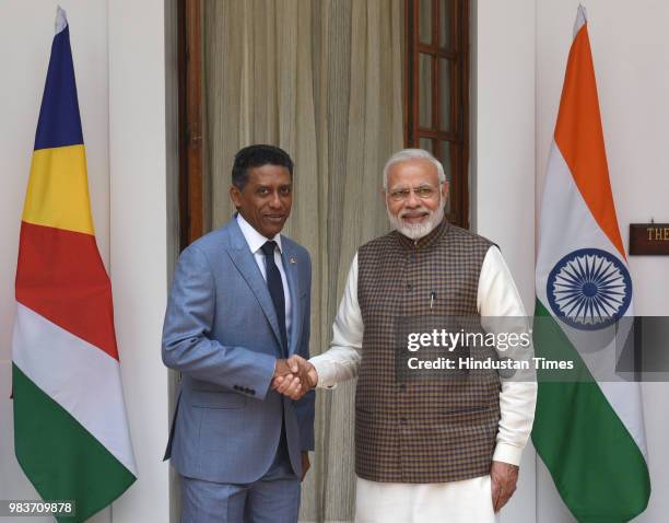 Prime Minister Narendra Modi shakes hand with Seychelles President Danny Antoine Rollen Faure ahead of a meeting at Hyderabad House on June 25, 2018...