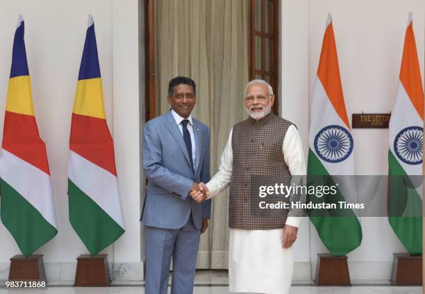 Prime Minister Narendra Modi shakes hand with Seychelles President Danny Antoine Rollen Faure ahead of a meeting at Hyderabad House on June 25, 2018...