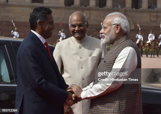 President of Seychelles Danny Antoine Rollen Faure shakes hand with Prime Minister Narendra Modi as President of India Ram Nath Kovind looks on at...