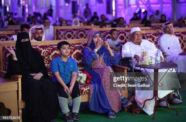 Men and women watch the Saudi Arabia vs. Egypt 2018 World Cup match at a public viewing in a tent on June 25, 2018 in Jeddah, Saudi Arabia. The Saudi...