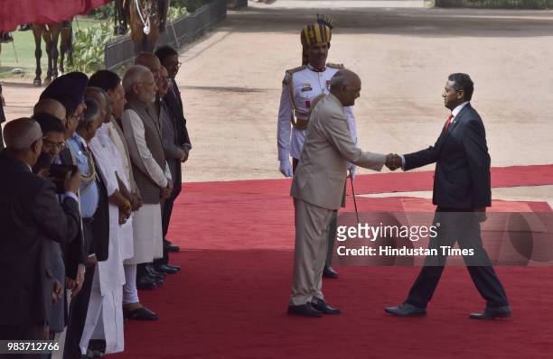 President Ram Nath Kovind shakes hand with his Seychelles counterpart Danny Antoine Rollen Faure during the ceremonial reception for Seychelles...