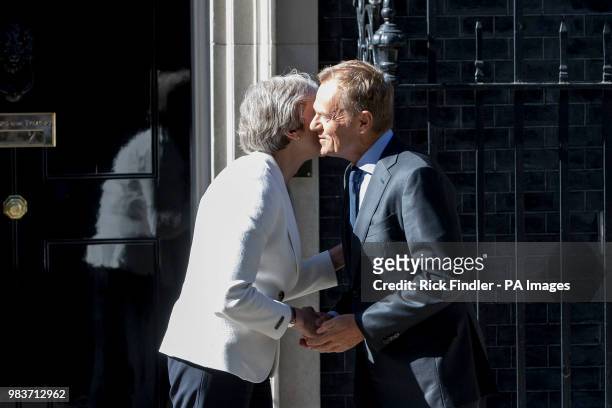 Prime Minister Theresa May greets President of the European Council Donald Tusk outside No 10 Downing Street, London, ahead of bilateral talks.