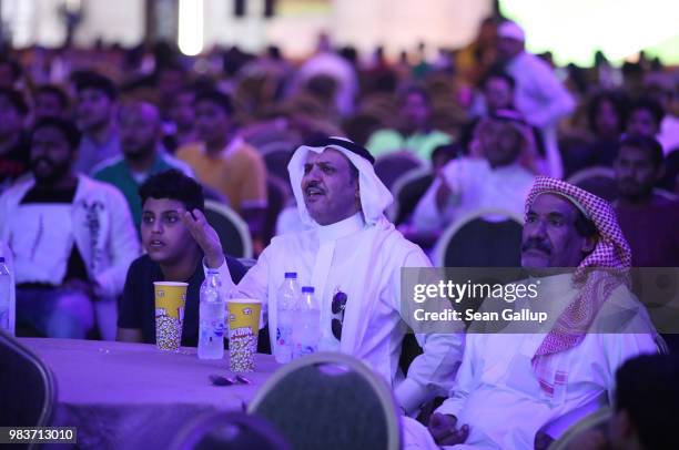 Men watch the Saudi Arabia vs. Egypt 2018 World Cup match at a public viewing in a mixed tent of men and women on June 25, 2018 in Jeddah, Saudi...