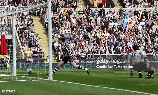 Andy Carroll watches as Jonas Gutierrez's cross come shot crosses the line for the opening goal during the Coca Cola Championship match between...