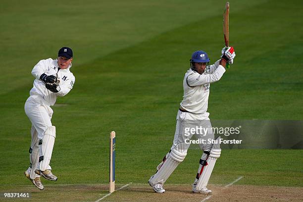 Warwickshire wicketkeeper Tim Ambrose looks on as Yorkshire batsman Adil Rashid hits out during the 2nd day of the Division One LV County...