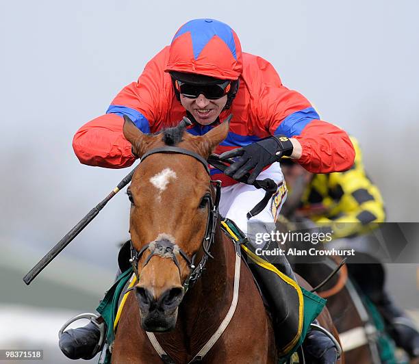 Khyber kim and Paddy Brennan jump the last to win The John Smith's Dick Francis Aintree Hurdle at Aintree racecourse on April 10, 2010 in Liverpool,...