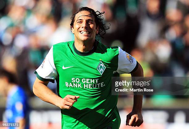Claudio Pizarro of Bremen celebrates after he scores his team's 3rd goal during the Bundesliga match between Werder Bremen and SC Freiburg at the...