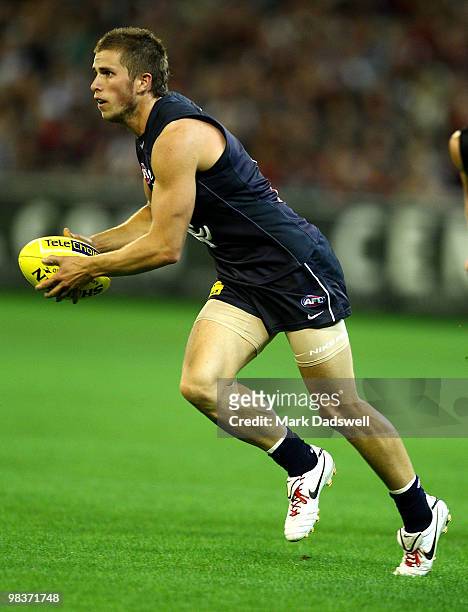 Marc Murphy of the Blues gathers the ball during the round three AFL match between the Carlton Blues and the Essendon Bombers at Melbourne Cricket...