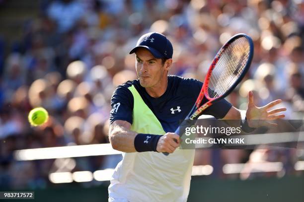 Britain's Andy Murray returns against Switzerland's Stan Wawrinka during a Men's singles first round match at the ATP Nature Valley International...