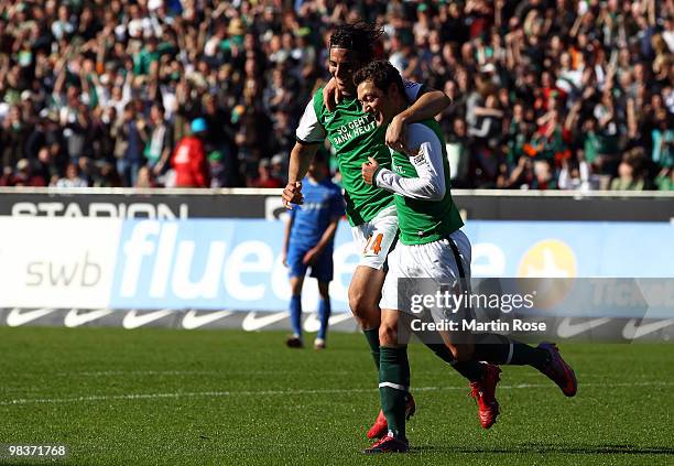 Mesut Oezil of Bremen celebrates after he scores his team's 4th goal during the Bundesliga match between Werder Bremen and SC Freiburg at the Weser...