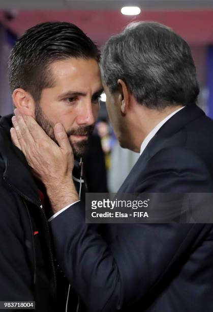 Vice president of Portugal footbal federadtion Humberto Coelho cheers Joao Moutinho prior to the 2018 FIFA World Cup Russia group B match between...