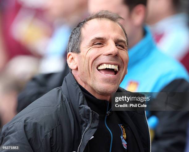 Gianfranco Zola, Manager of West Ham United shares a joke before the Barclays Premier League match between West Ham United and Sunderland at Upton...