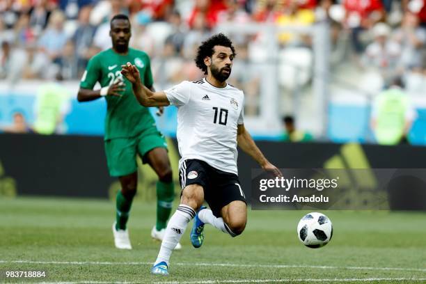 Mohamed Salah of Egypt in action against Motaz Hawsaw of Saudi Arabia during the 2018 FIFA World Cup Russia Group A match between Saudi Arabia and...