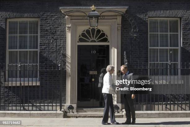 Theresa May, U.K. Prime minister, left, and Donald Tusk, president of the European Union , shake hands outside number 10 Downing Street in London,...
