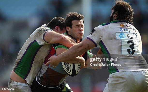 Danny Care of Quins is tackled by Mike MacDonald and Juan Gomez of Leeds during the Guinness Premiership match between Harlequins and Leeds Carnegie...