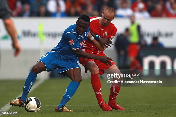Chinedu Obasi of Hoffenheim battles for the ball with Miso Brecko of Koeln during the Bundesliga match between 1899 Hoffenheim and 1. FC Koeln at...