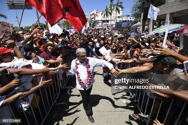 Mexico's presidential candidate for the MORENA party, Andres Manuel Lopez Obrador, is greeted by supporters during a campaign rally in Acapulco,...