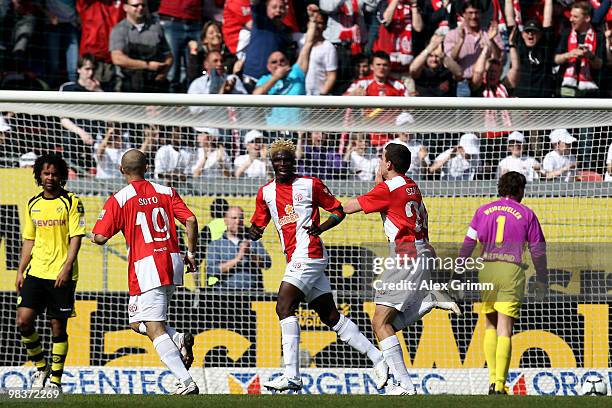 Adam Szalai of Mainz celebrates his team's first goal with team mates Aristide Bance and Elkin Soto during the Bundesliga match between FSV Mainz 05...