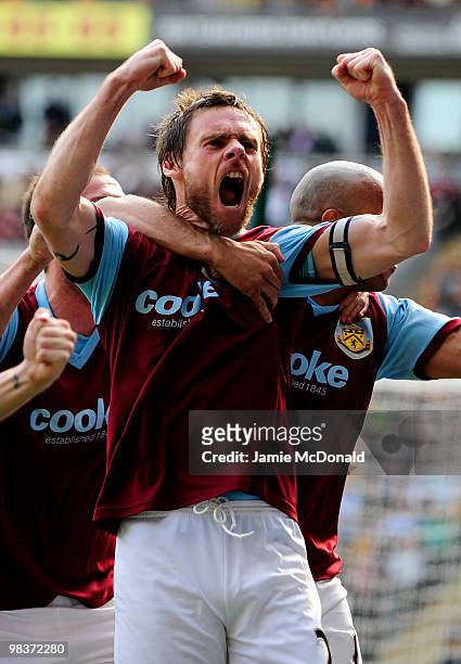 Graham Alexander of Burnley celebrates scoring his team's second goal from a penalty during the Barclays Premier League match between Hull City and...