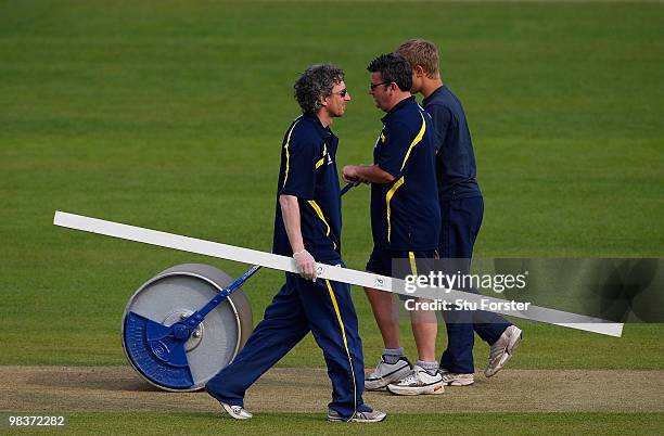 Ex- Warwickshire wicketkeeper Tony Frost goes about his work as a groundsman during the 2nd day of the Division One LV County Championship match...