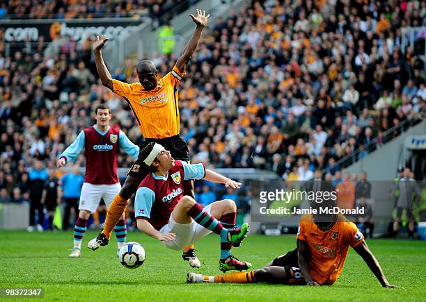 Ibrahima Sonko of Hull City concedes a penalty for a foul on Michael Duff of Burnley during the Barclays Premier League match between Hull City and...