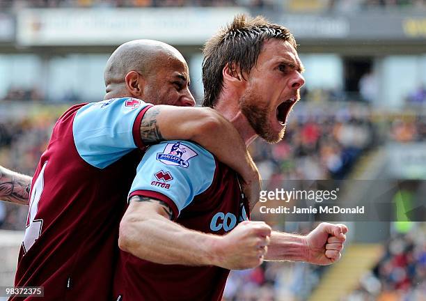 Graham Alexander of Burnley celebrates with his team mate Tyrone Mears after scoring his team's second goal from a penalty during the Barclays...