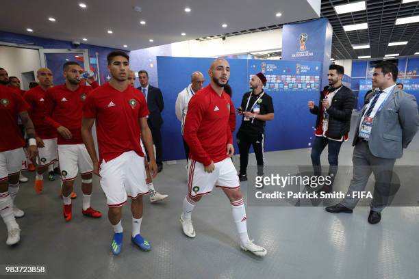 Achraf Hakimi of Morocco and Noureddine Amrabat of Morocco walk out for the warm up prior to the 2018 FIFA World Cup Russia group B match between...