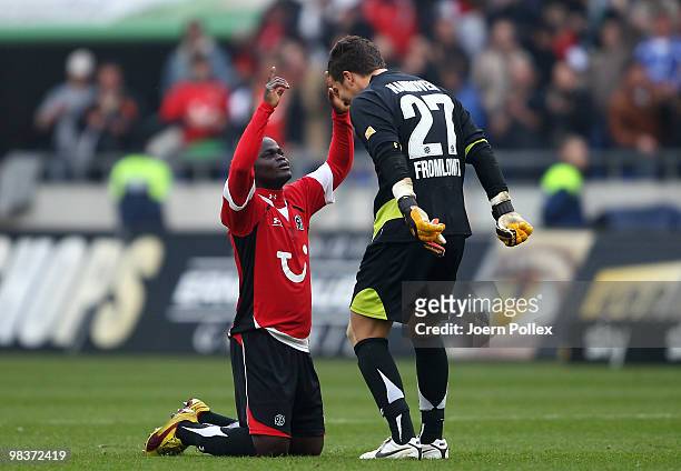Didier Ya Konan and Florian Fromlowitz of Hannover celebrate after winning the Bundesliga match between Hannover 96 and FC Schalke 04 at AWD Arena on...