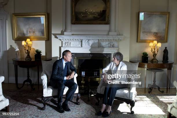 Donald Tusk, president of the European Union , speaks while Theresa May, U.K. Prime minister, right, listens during a meeting inside number 10...