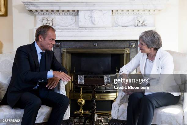 Donald Tusk, president of the European Union , speaks while Theresa May, U.K. Prime minister, right, listens during a meeting inside number 10...