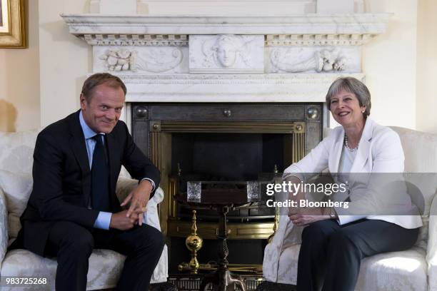 Donald Tusk, president of the European Union , and Theresa May, U.K. Prime minister, right, smile for a photograph during a meeting inside number 10...